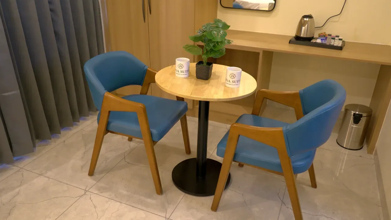 Seating area in a room at Jiana Suites